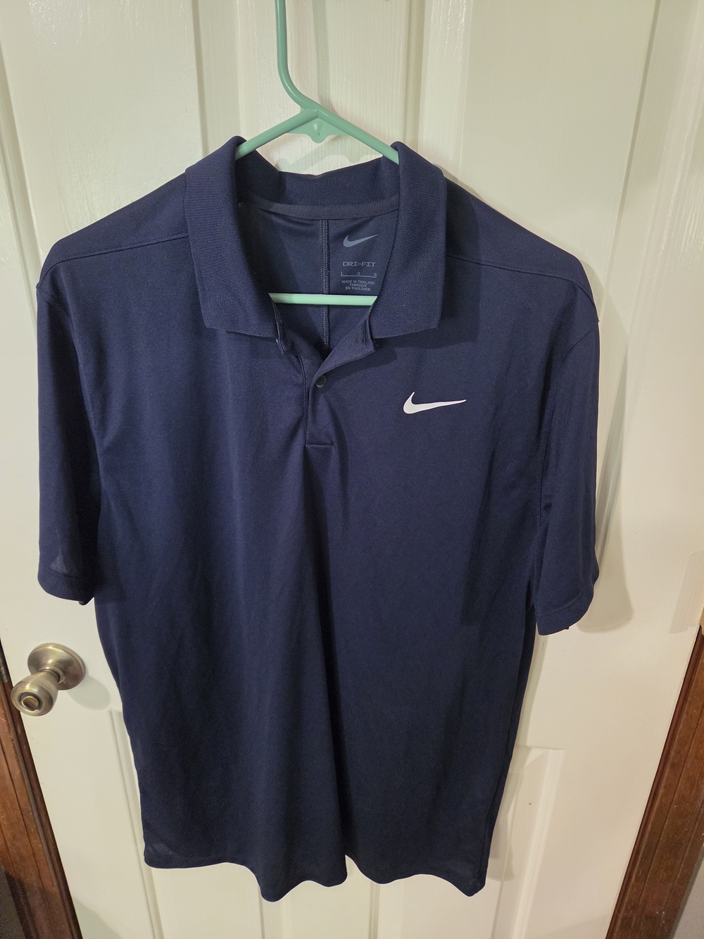 Nike Men’s Navy Blue Dri-FIT Polo with White Swoosh
